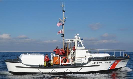 US Coast Guard Cutter with flags on the mast